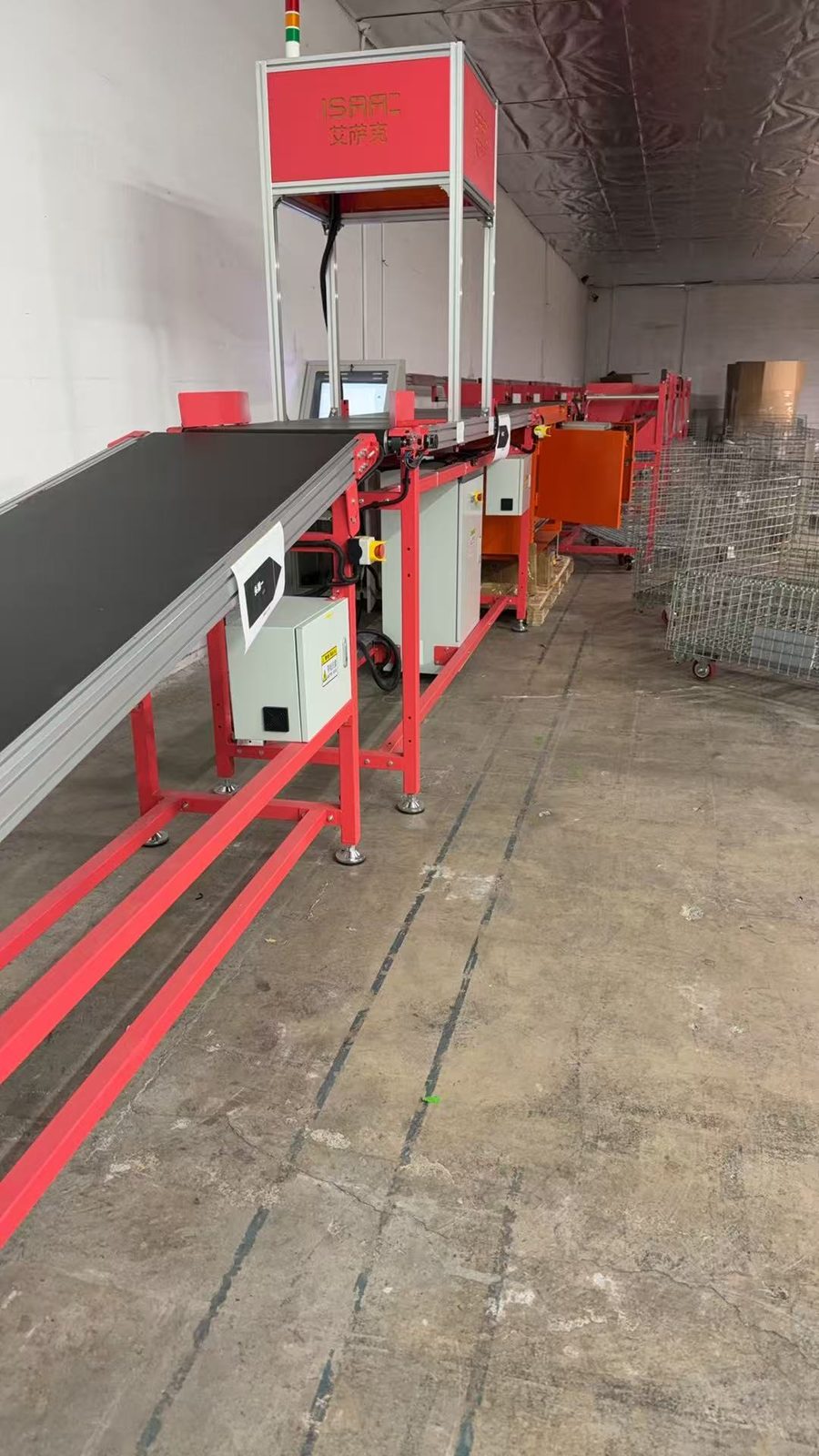 The scan gantry and control station seen from the side during installation